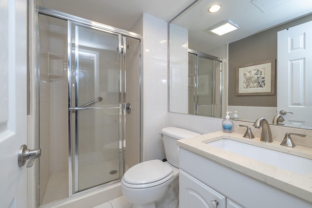 2800 N Atlantic Ave Unit 1716, Daytona Beach, FL 32118 - bathroom featuring toilet, vanity, a shower stall, recessed lighting, and tile walls