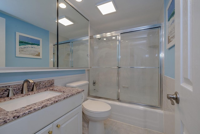 2800 N Atlantic Ave Unit 1716, Daytona Beach, FL 32118 - bathroom with vanity, shower / bath combination with glass door, toilet, and tile patterned floors