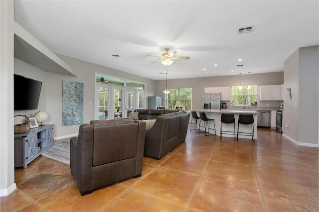 3671 Plantation Dr, Ormond Beach, FL 32174 - living area with ceiling fan, recessed lighting, and light tile patterned floors
