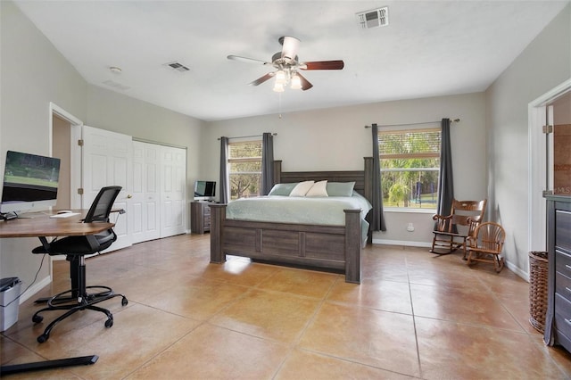 3671 Plantation Dr, Ormond Beach, FL 32174 - bedroom with an office area, multiple windows, light tile patterned floors, and a closet
