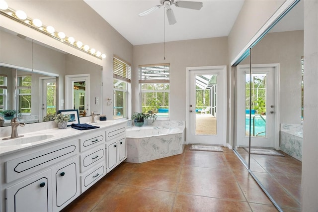 3671 Plantation Dr, Ormond Beach, FL 32174 - full bath featuring a bath, plenty of natural light, double vanity, and ceiling fan