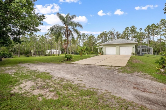 3671 Plantation Dr, Ormond Beach, FL 32174 - view of green lawn with driveway