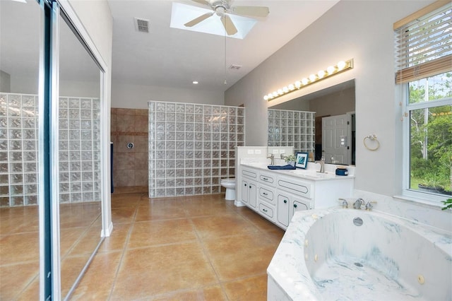 3671 Plantation Dr, Ormond Beach, FL 32174 - full bathroom featuring double vanity, a jetted tub, ceiling fan, a walk in shower, and tile patterned floors
