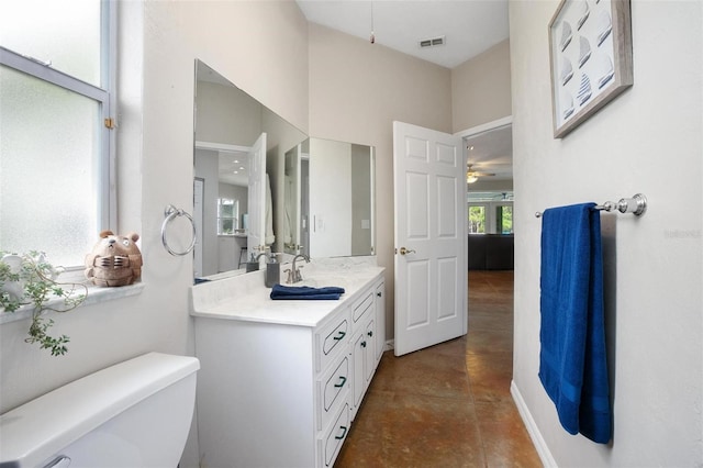 3671 Plantation Dr, Ormond Beach, FL 32174 - bathroom featuring a ceiling fan, concrete flooring, and vanity