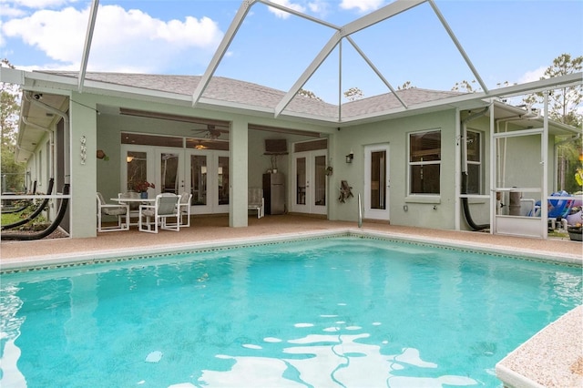 3671 Plantation Dr, Ormond Beach, FL 32174 - rear view of property featuring french doors, stucco siding, an outdoor pool, and a patio