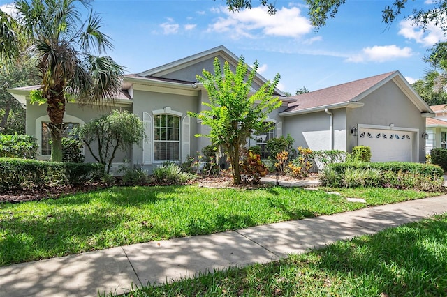 45 Saint Andrews Ct, Palm Coast, FL 32137 - single story home featuring stucco siding, an attached garage, and a front lawn