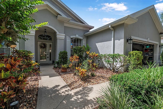 45 Saint Andrews Ct, Palm Coast, FL 32137 - property entrance with stucco siding and a garage