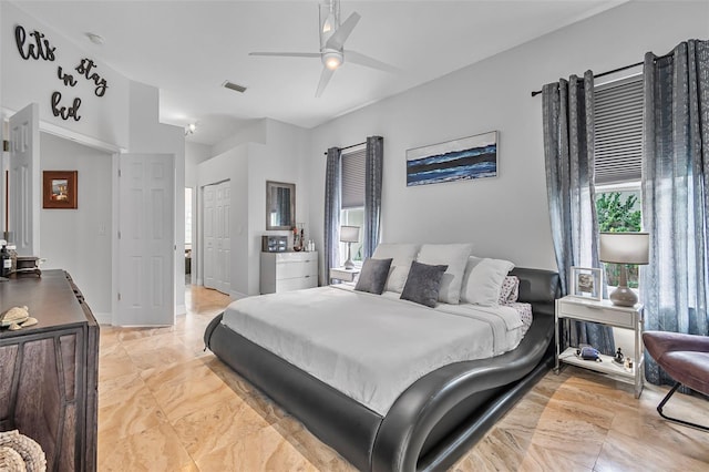 45 Saint Andrews Ct, Palm Coast, FL 32137 - bedroom with ceiling fan, a closet, and light marble finish floors