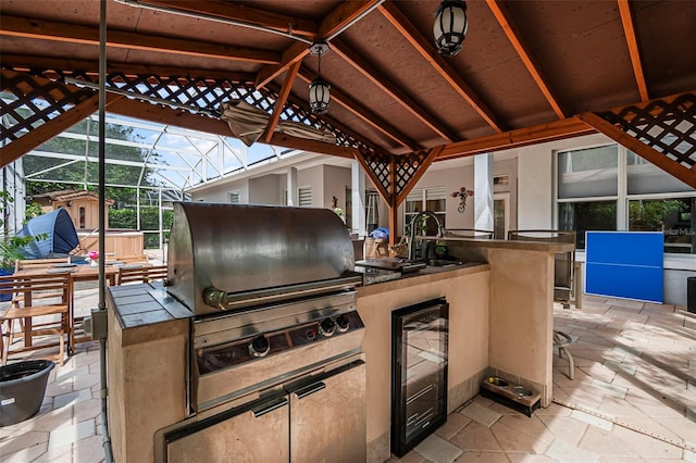 45 Saint Andrews Ct, Palm Coast, FL 32137 - view of patio featuring wine cooler, area for grilling, and glass enclosure