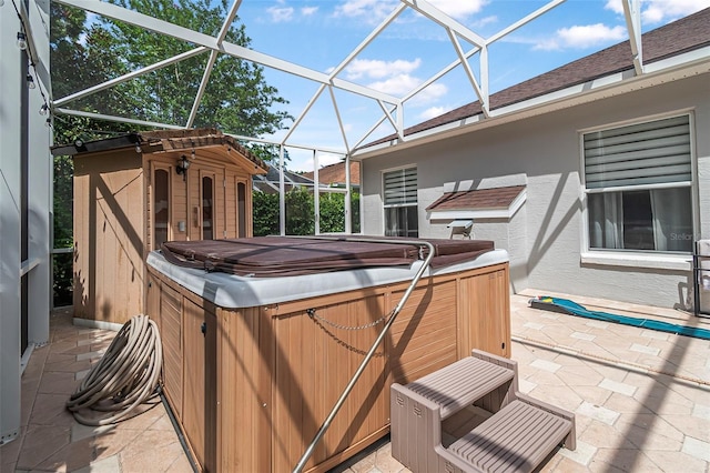 45 Saint Andrews Ct, Palm Coast, FL 32137 - view of patio / terrace featuring a hot tub and a lanai