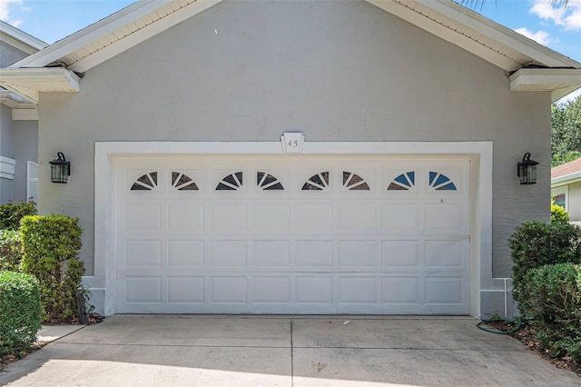 45 Saint Andrews Ct, Palm Coast, FL 32137 - garage featuring concrete driveway