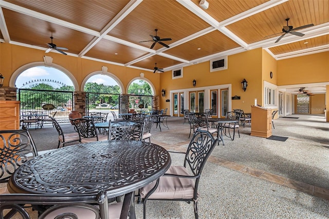 45 Saint Andrews Ct, Palm Coast, FL 32137 - view of patio / terrace with a ceiling fan, outdoor dining space, and french doors
