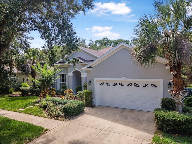 45 Saint Andrews Ct, Palm Coast, FL 32137 - view of front of house featuring stucco siding, an attached garage, and driveway