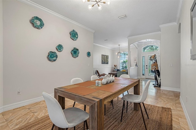 45 Saint Andrews Ct, Palm Coast, FL 32137 - dining space featuring a chandelier, crown molding, a textured ceiling, and arched walkways