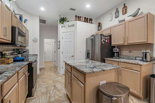 45 Saint Andrews Ct, Palm Coast, FL 32137 - kitchen featuring stainless steel appliances, decorative backsplash, light stone countertops, a center island, and recessed lighting