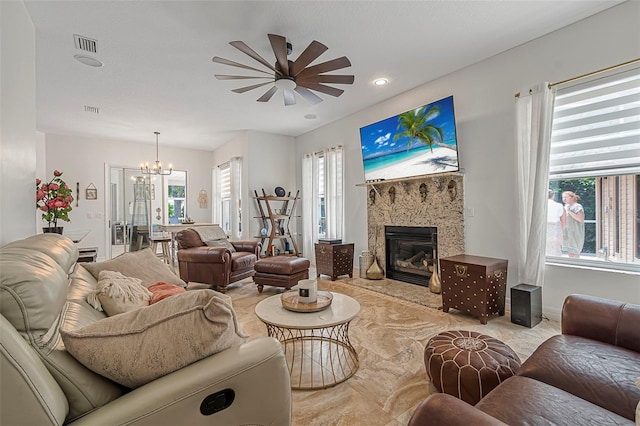 45 Saint Andrews Ct, Palm Coast, FL 32137 - living room featuring a chandelier, a ceiling fan, a tiled fireplace, and recessed lighting