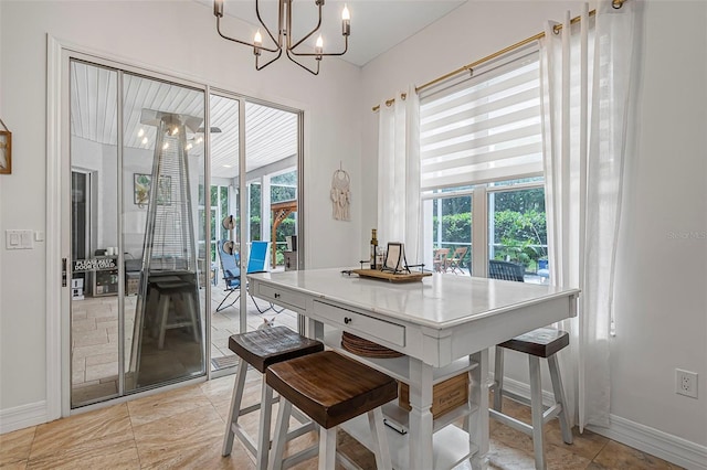 45 Saint Andrews Ct, Palm Coast, FL 32137 - dining area featuring baseboards and a chandelier
