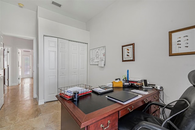 45 Saint Andrews Ct, Palm Coast, FL 32137 - office area featuring a towering ceiling and baseboards