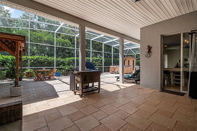 45 Saint Andrews Ct, Palm Coast, FL 32137 - view of patio featuring glass enclosure, a hot tub, and outdoor dining space