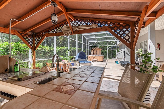 45 Saint Andrews Ct, Palm Coast, FL 32137 - view of patio / terrace featuring glass enclosure and outdoor dining space