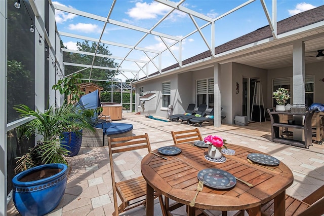 45 Saint Andrews Ct, Palm Coast, FL 32137 - view of patio / terrace with outdoor dining space and glass enclosure