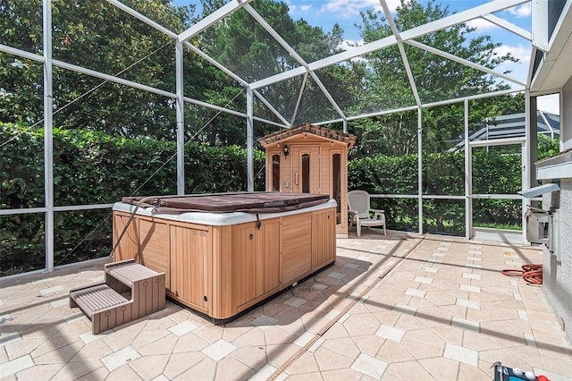 45 Saint Andrews Ct, Palm Coast, FL 32137 - view of patio / terrace with a hot tub, glass enclosure, and a storage unit