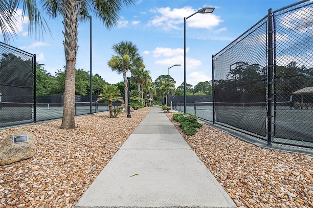 45 Saint Andrews Ct, Palm Coast, FL 32137 - view of tennis court featuring a gate