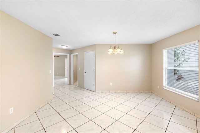 2708 Smithfield Dr, Orlando, FL 32837 - unfurnished room with a chandelier and a textured ceiling