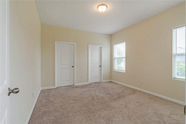 2241 Litchfield Loop, Deland, FL 32720 - unfurnished bedroom with carpet and multiple windows