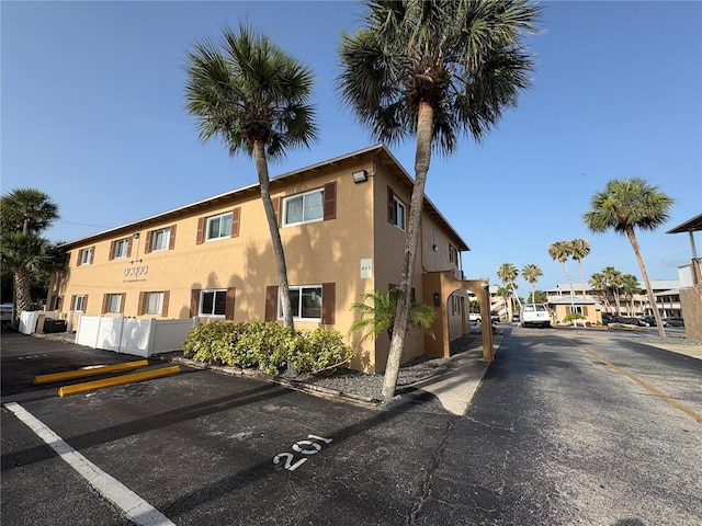 411 N Halifax Ave Unit 208, Daytona Beach, FL 32118 - view of building exterior with uncovered parking