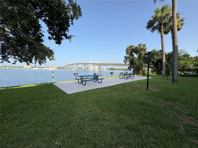 411 N Halifax Ave Unit 208, Daytona Beach, FL 32118 - view of property's community with a water view and a lawn
