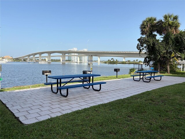 411 N Halifax Ave Unit 208, Daytona Beach, FL 32118 - view of community with a water view and a lawn