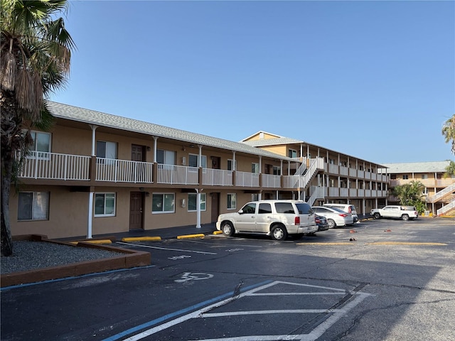 411 N Halifax Ave Unit 208, Daytona Beach, FL 32118 - view of property featuring uncovered parking