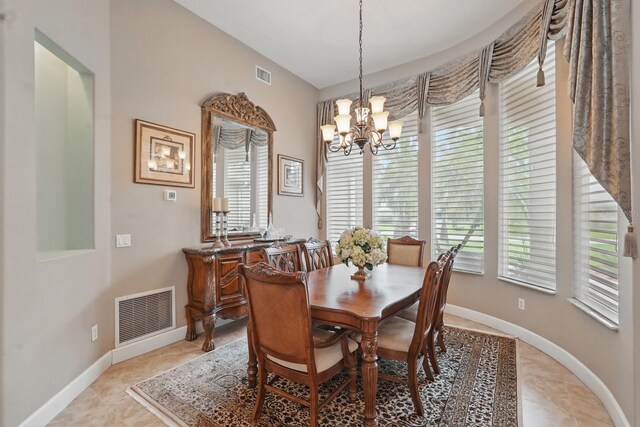 33 Coquina Ridge Way, Ormond Beach, FL 32174 - dining space with a chandelier, baseboards, and light tile patterned flooring
