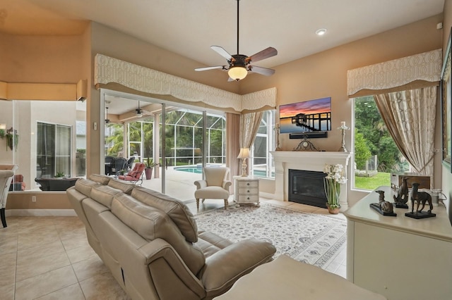 33 Coquina Ridge Way, Ormond Beach, FL 32174 - living area with a ceiling fan, light tile patterned floors, a sunroom, and healthy amount of natural light