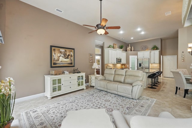33 Coquina Ridge Way, Ormond Beach, FL 32174 - living room with light tile patterned floors, a ceiling fan, baseboards, and recessed lighting