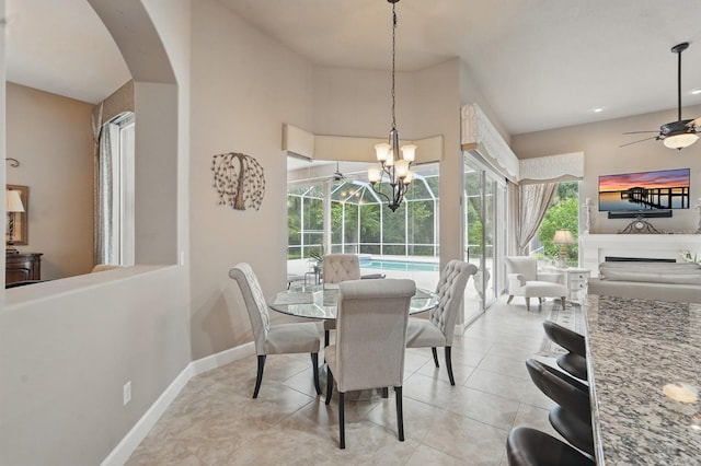 33 Coquina Ridge Way, Ormond Beach, FL 32174 - dining area with a ceiling fan, arched walkways, healthy amount of natural light, and baseboards