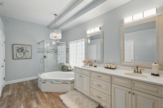 33 Coquina Ridge Way, Ormond Beach, FL 32174 - full bathroom with a shower stall, double vanity, a garden tub, a chandelier, and wood finished floors