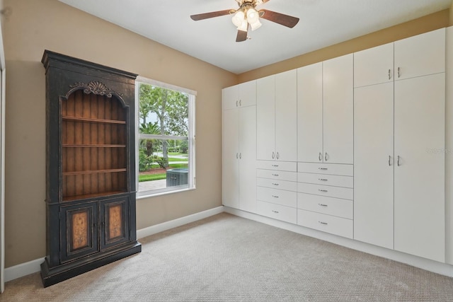 33 Coquina Ridge Way, Ormond Beach, FL 32174 - unfurnished bedroom featuring light colored carpet, baseboards, and ceiling fan