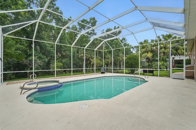 33 Coquina Ridge Way, Ormond Beach, FL 32174 - view of swimming pool with a patio, a pool with connected hot tub, view of scattered trees, and a lanai