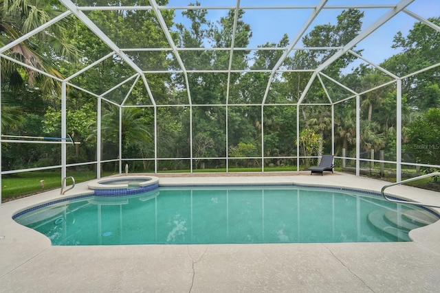 33 Coquina Ridge Way, Ormond Beach, FL 32174 - view of swimming pool featuring a lanai, a pool with connected hot tub, and a patio area