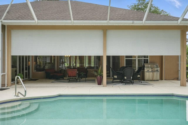 33 Coquina Ridge Way, Ormond Beach, FL 32174 - swimming pool with grilling area, a patio area, and glass enclosure
