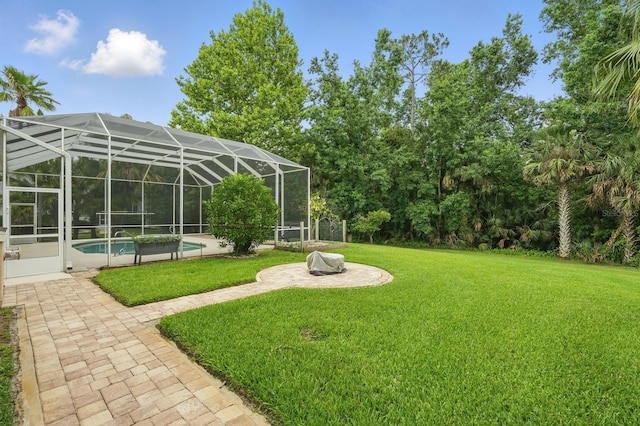 33 Coquina Ridge Way, Ormond Beach, FL 32174 - view of green lawn with a patio, an outdoor pool, and glass enclosure