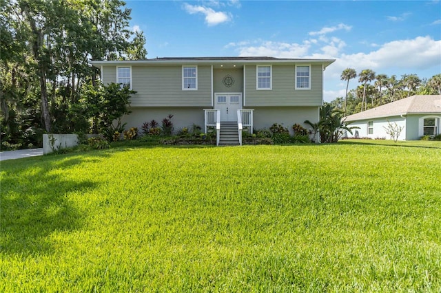 2250 Davis Dr, New Smyrna Beach, FL 32168 - raised ranch with a front yard and stucco siding