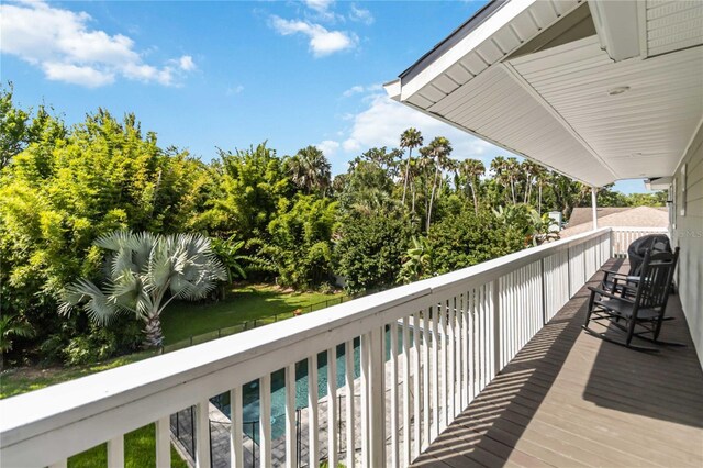 2250 Davis Dr, New Smyrna Beach, FL 32168 - wooden deck featuring an outdoor pool