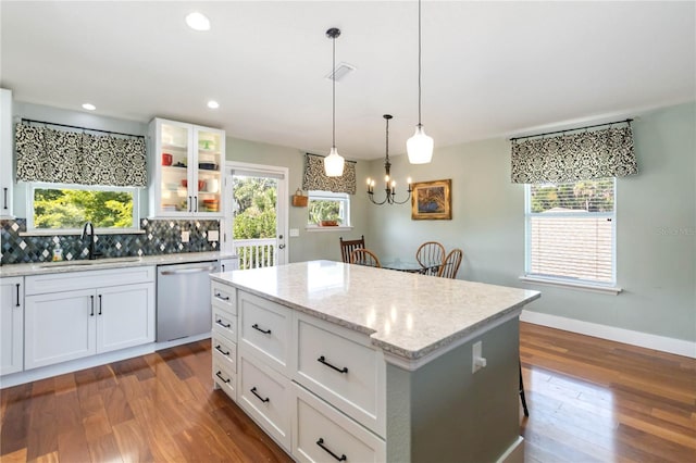 2250 Davis Dr, New Smyrna Beach, FL 32168 - kitchen with stainless steel dishwasher, dark wood-style flooring, healthy amount of natural light, a center island, and recessed lighting
