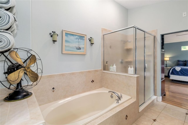 2250 Davis Dr, New Smyrna Beach, FL 32168 - ensuite bathroom with a bath, a stall shower, and tile patterned flooring