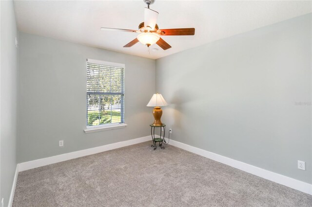 2250 Davis Dr, New Smyrna Beach, FL 32168 - carpeted empty room with a ceiling fan and baseboards