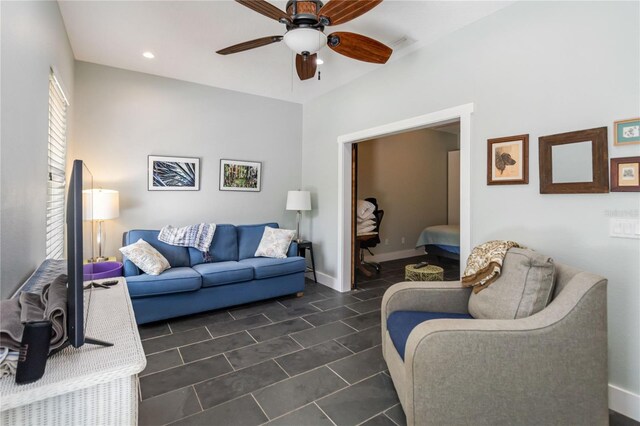 2250 Davis Dr, New Smyrna Beach, FL 32168 - living area featuring a ceiling fan, dark tile patterned floors, and recessed lighting