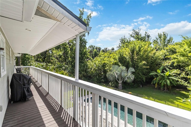 2250 Davis Dr, New Smyrna Beach, FL 32168 - wooden deck featuring grilling area and an outdoor pool